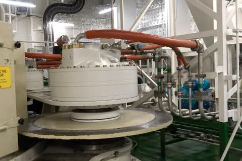 The engine compartment of the ship. Engine and steering equipment. Stock Photos