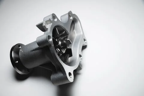 Engine coolant pump. New spare part on a contrasting gradient background for car Stock Photos