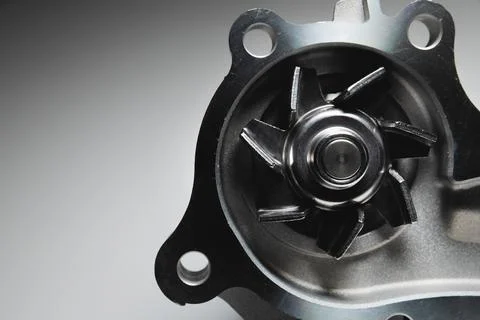Engine coolant pump. New spare part on a contrasting gradient background for car Stock Photos