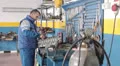 engine on the desk - auto mechanic repairs a motor of a car - dolly HD Footage