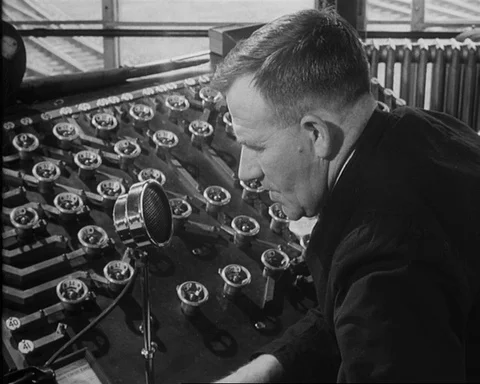 Engine driver communicating with train dispatcher, UK 1957 Stock Footage 132323326