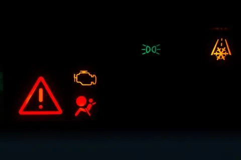 Engine Emissions warning light show on a black background Stock Photos