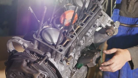 The engine is hanging separately from the car Stock Footage 90858396