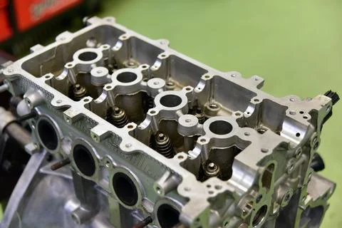 Engine head. Opened cylinder head from a car engine. Stock Photos
