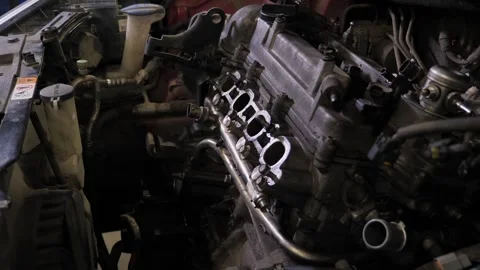 The engine in the hood of the car, car maintenance in the service center. Stock Footage 339788508