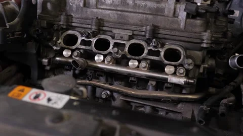 The engine in the hood of the car, car maintenance in the service center. Stock Footage 341867903