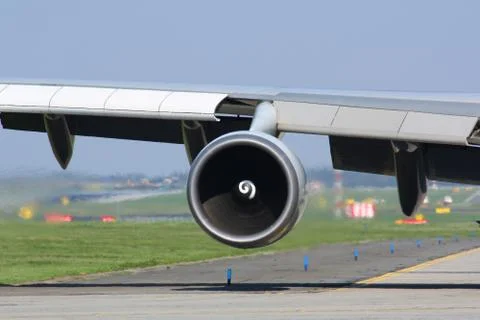 Engine of huge airplane Stock Photos