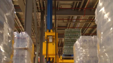 Engine lifting down Packages of Bottle in a Warehouse/Factory  Stock Footage 131956672