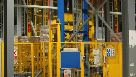 Engine lifting up Packages in a Warehouse/Factory  Video stock 131955588
