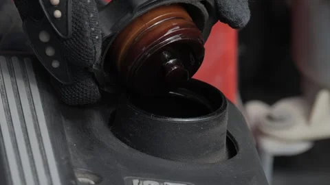 Engine Maintenance Ensure that you are checking fluid levels while wearing Stock Footage 308967339