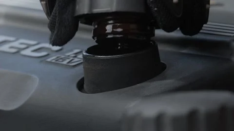 Engine Maintenance How to Properly Remove and Install a Fuel Cap for Your Stock Footage 308967530