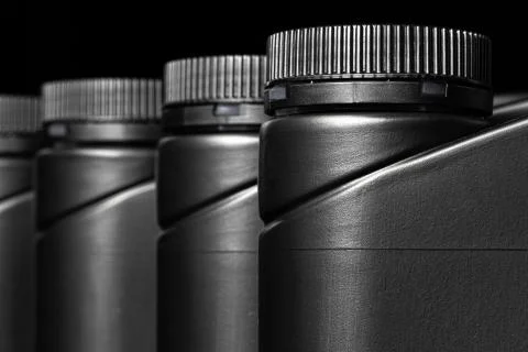 Engine oil bottle on black background, close up. 스톡 사진