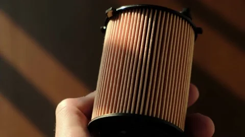 Engine oil filter in driver's hands, close-up Video stock 196595533