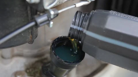 Engine oil is poured into the engine for good engine operation Stock Footage 201323483