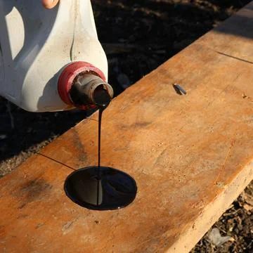 Engine oil in the use of wood processing Stock Photos