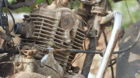 Engine of an old abandoned motorbike with rust and dust Stock Photos