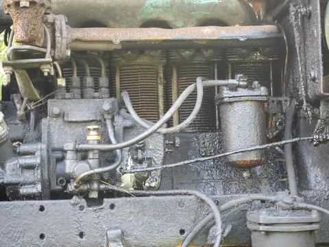 Engine on an old tractor on a bright Sunny day. Light, blur Stock Photos