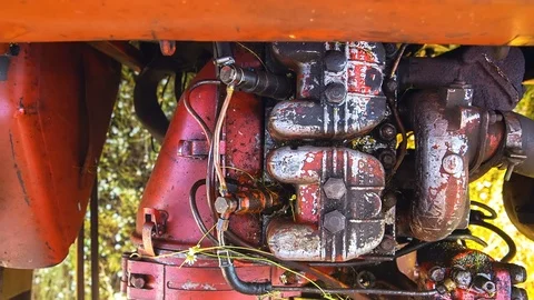 The engine of an old tractor that works in the field, the top view Stock Footage 92033270