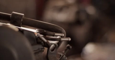 Engine parts on workbench in garage Stock Footage 221106859