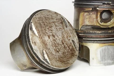 Engine piston flat surface with valve reliefs, close-up. in badly cleaned  .. Stock Photos