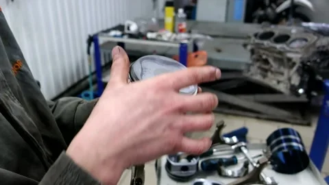 Engine piston, in the hands of a mechanic 1 Stock Footage 150266705