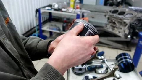 Engine piston, in the hands of a mechanic Stock Footage 150266701