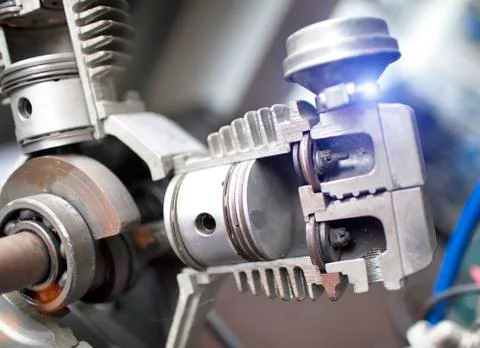 Engine pistons in a section, are visible internal details Stock Photos