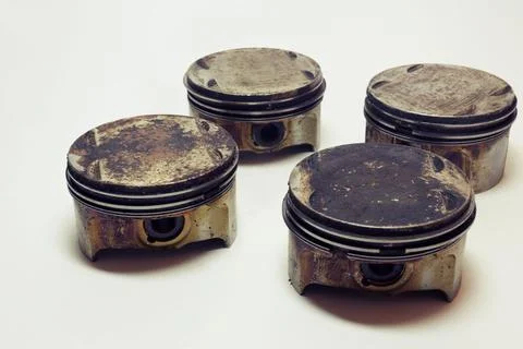 Engine pistons set of four. worn out change part of old car motor. all surf.. Stock Photos
