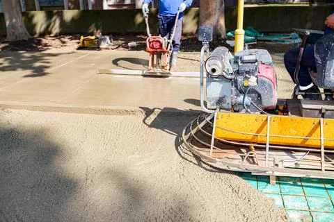 Engine of power trowel, machine for finishing, leveling concrete surface Stock Photos
