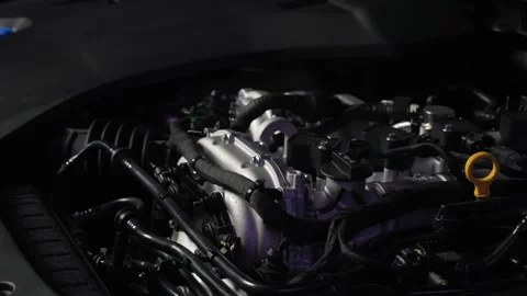 Engine of a premium car in a dark room of a dealership. Studio lighting Stock Footage 268162208