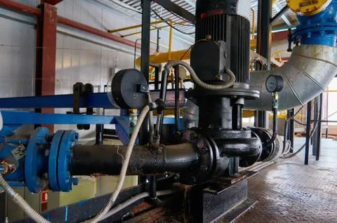 Engine with pump and manometer on the pipeline. Stock Photos