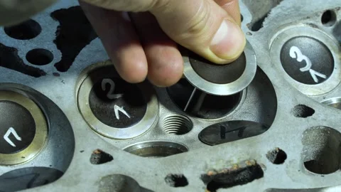 Engine repair. Auto mechanic working on car engine in mechanics garage Stock Footage 302459631