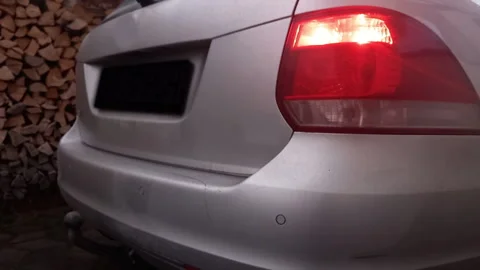 Engine Revving with a Growing Roar Close-up on Illuminated Rear Brake Lights Stock Footage 322575880