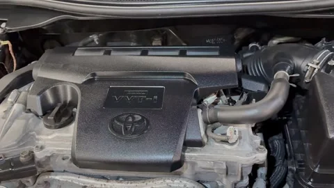The engine room of all Toyota Camry showing the VVT-I. Stock Footage 329798954