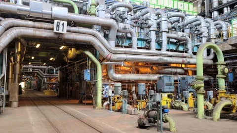 Engine room of a coal-fired power plant with intricate machinery and Stock Footage 288056733