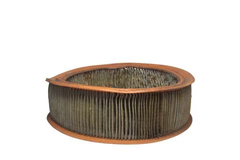 Engine round air filter, with clogged up paper media. old, dusty and worn, .. Stock Photos
