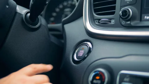 Engine start and stop button is being pushed with a finger Stock Footage 101186969