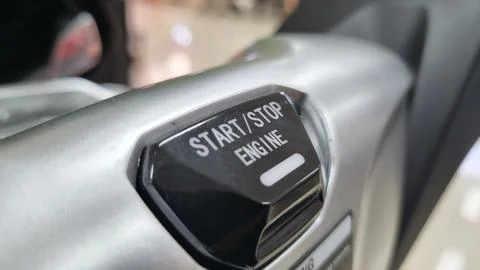 Engine start and stop button of a electric motorcycle. Stock Photos