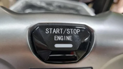 Engine start and stop button of a electric motorcycle. Stock Photos