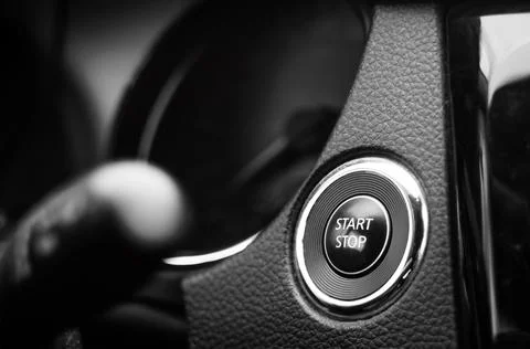 Engine start and stop button on dashboard. Keyless smart key on a modern vehi Foto stock