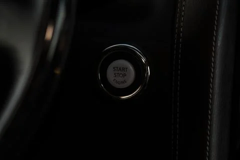 Engine start button close up. Car engine start button. Stock Photos