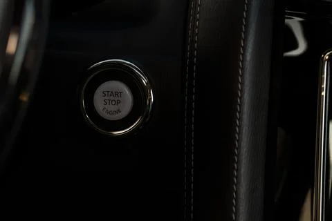 Engine start button close up. Car engine start button. Stock Photos