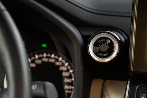 Engine start button with close up. Car engine start button. Foto stock