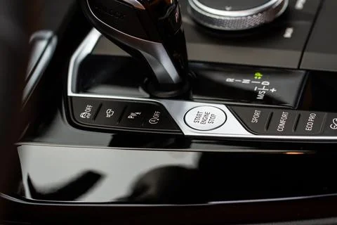 Engine start button. Close up engine car start stop button. Modern car interi Stock Photos