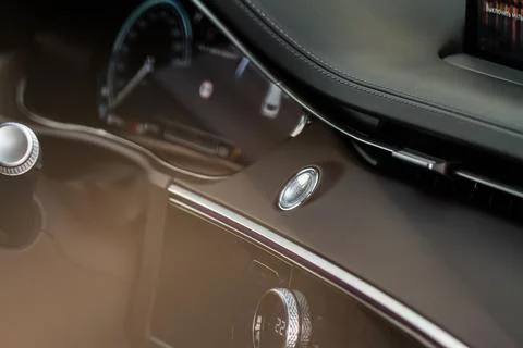 Engine start button. Close up engine car start stop button. Modern car interi Stock Photos