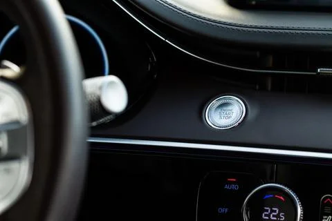 Engine start button. Close up engine car start stop button. Modern car interi Stock Photos