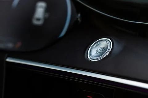 Engine start button. Close up engine car start stop button. Modern car interi Stock Photos