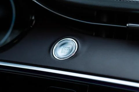 Engine start button. Close up engine car start stop button. Modern car interi Stock Photos