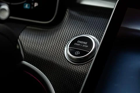 Engine start button. Close up engine car start stop button. Modern car interi Foto stock