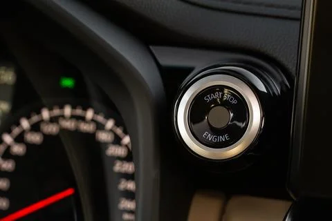 Engine start button. Close up engine car start stop button. Modern car interi Foto stock